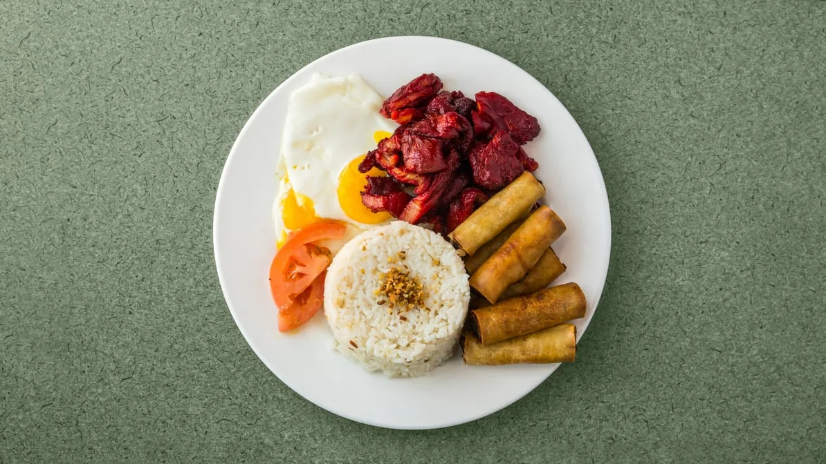 Deluxe Filipino Breakfast with tocino, lumpia, garlic fried rice and two eggs at Kalan Restaurant and Catering Services, Winnipeg