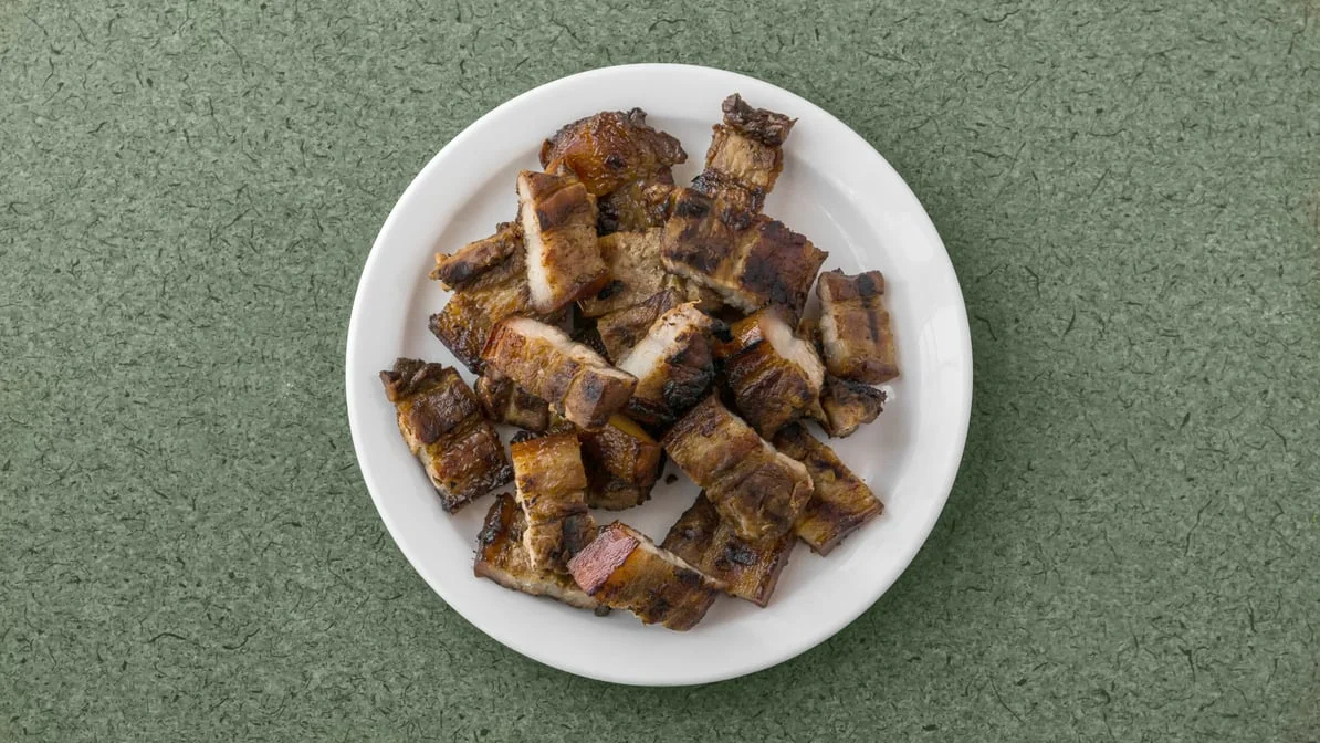 Grilled liempo, marinated pork belly chopped and served at Kalan Restaurant, 1449 Arlington Street, Winnipeg