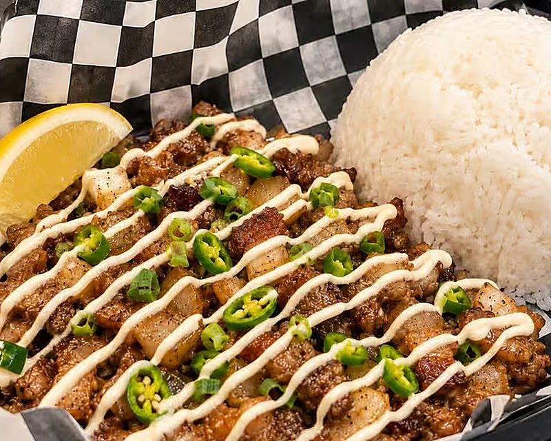 Crispy sisig with rice, calamansi and creamy sauce at Kalan Restaurant, North End Winnipeg