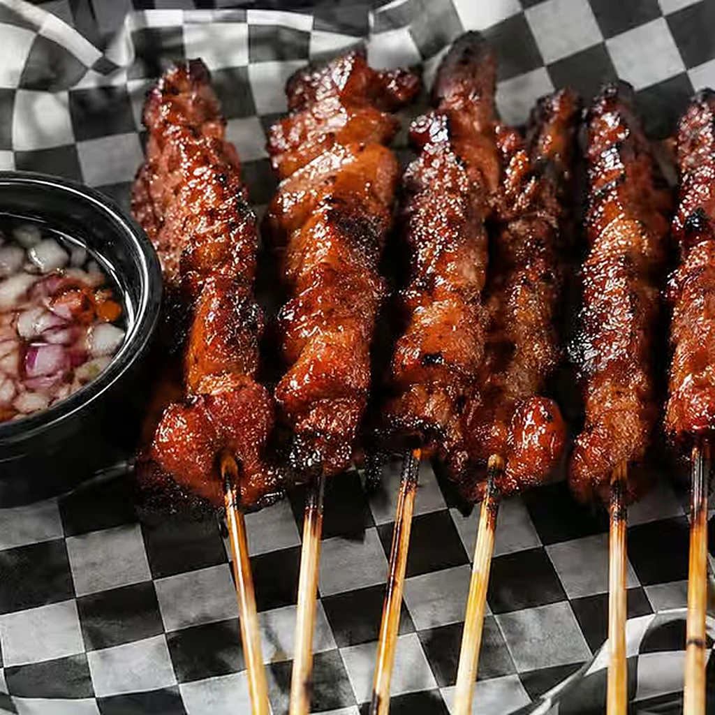 Filipino pork barbecue skewers grilled at Kalan Restaurant and Catering Services, Winnipeg