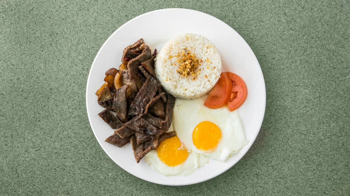 Tapsilog marinated beef tapa with garlic fried rice and two eggs at Kalan Restaurant and Catering Services, Winnipeg