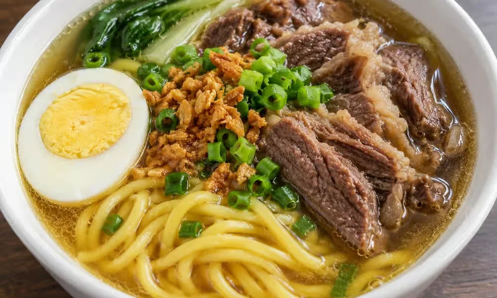 Mami, Filipino noodle soup with braised beef and boiled egg, from the All Day Cravings menu at Kalan At Night, Winnipeg