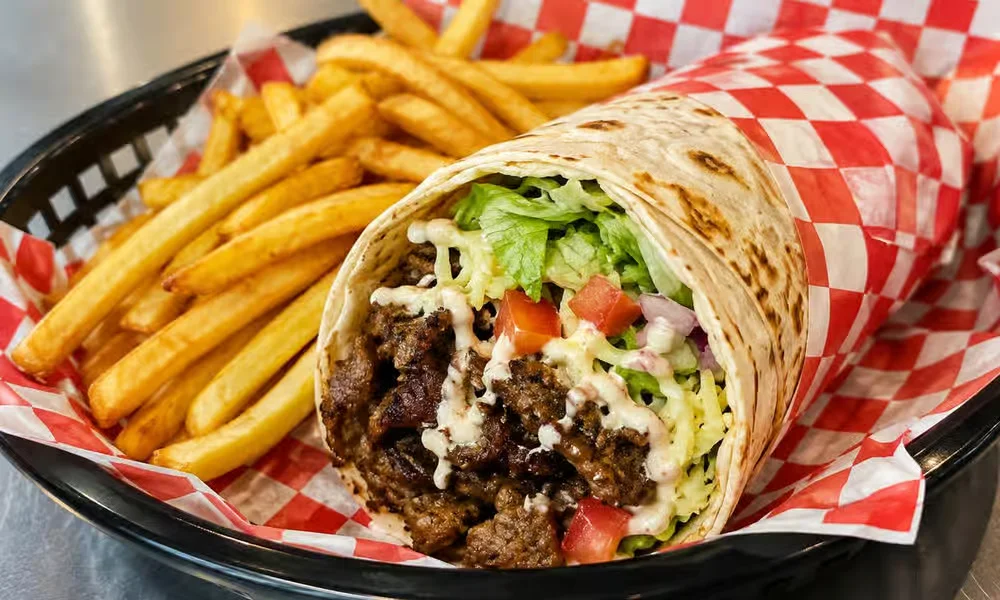 Shawarma wrap served with fries from the late-night shawarma line at Kalan At Night, Arlington Street, Winnipeg